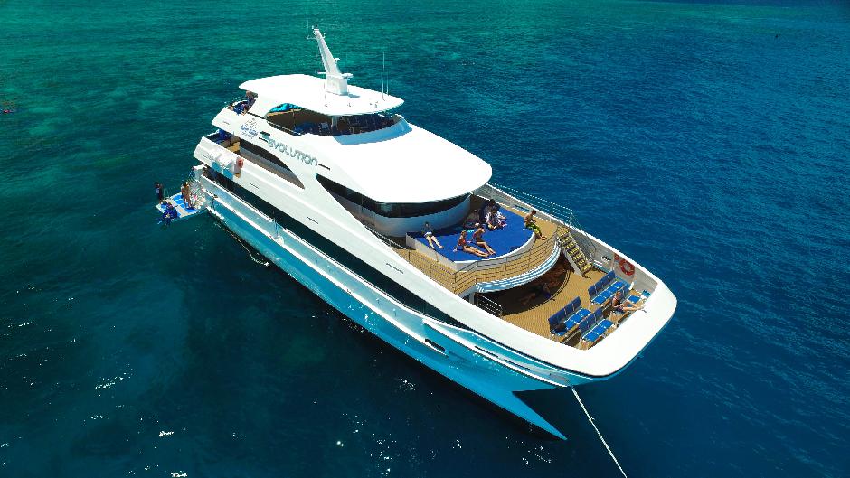 Experience the best Great Barrier Reef tour in Cairns, and travel onboard the most luxurious super-yacht, EVOLUTION, to the Outer Great Barrier Reef.